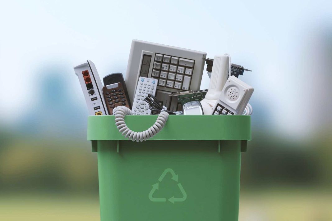 Waste bin full of e-waste Recycle Electronics And Minimize E-Waste